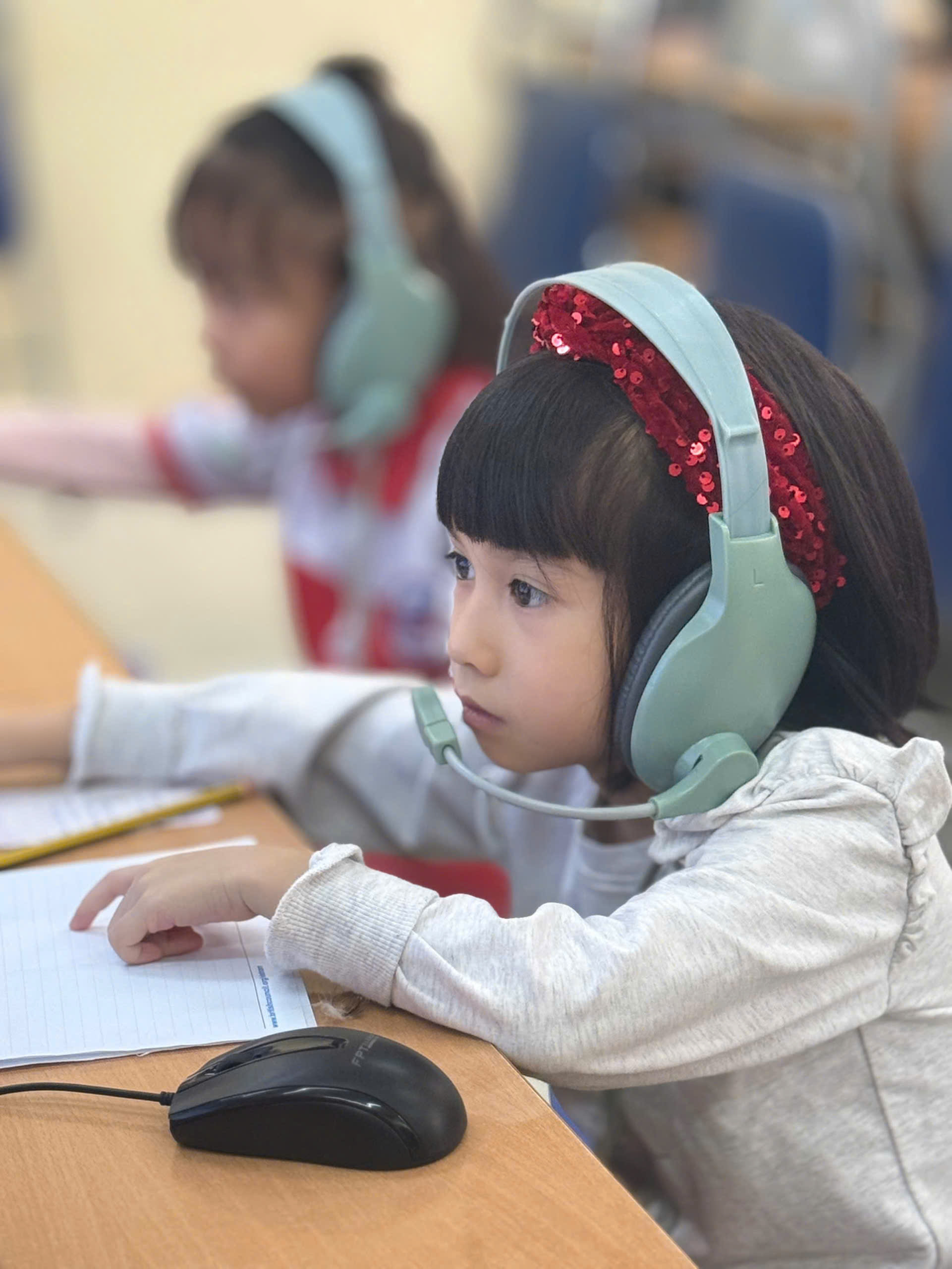 A young child wearing headphones

AI-generated content may be incorrect.
