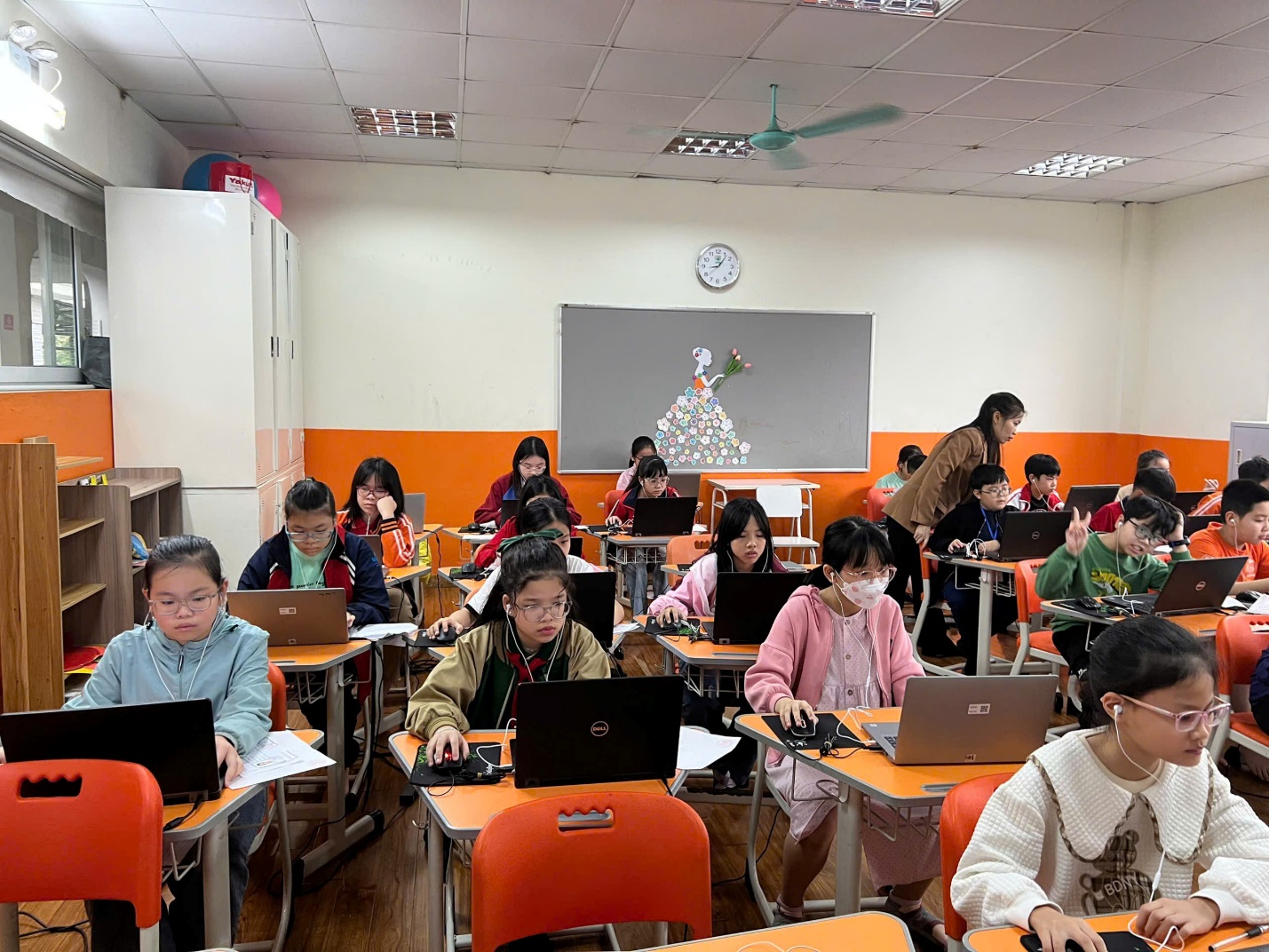 A group of children in a classroom using laptops

AI-generated content may be incorrect.