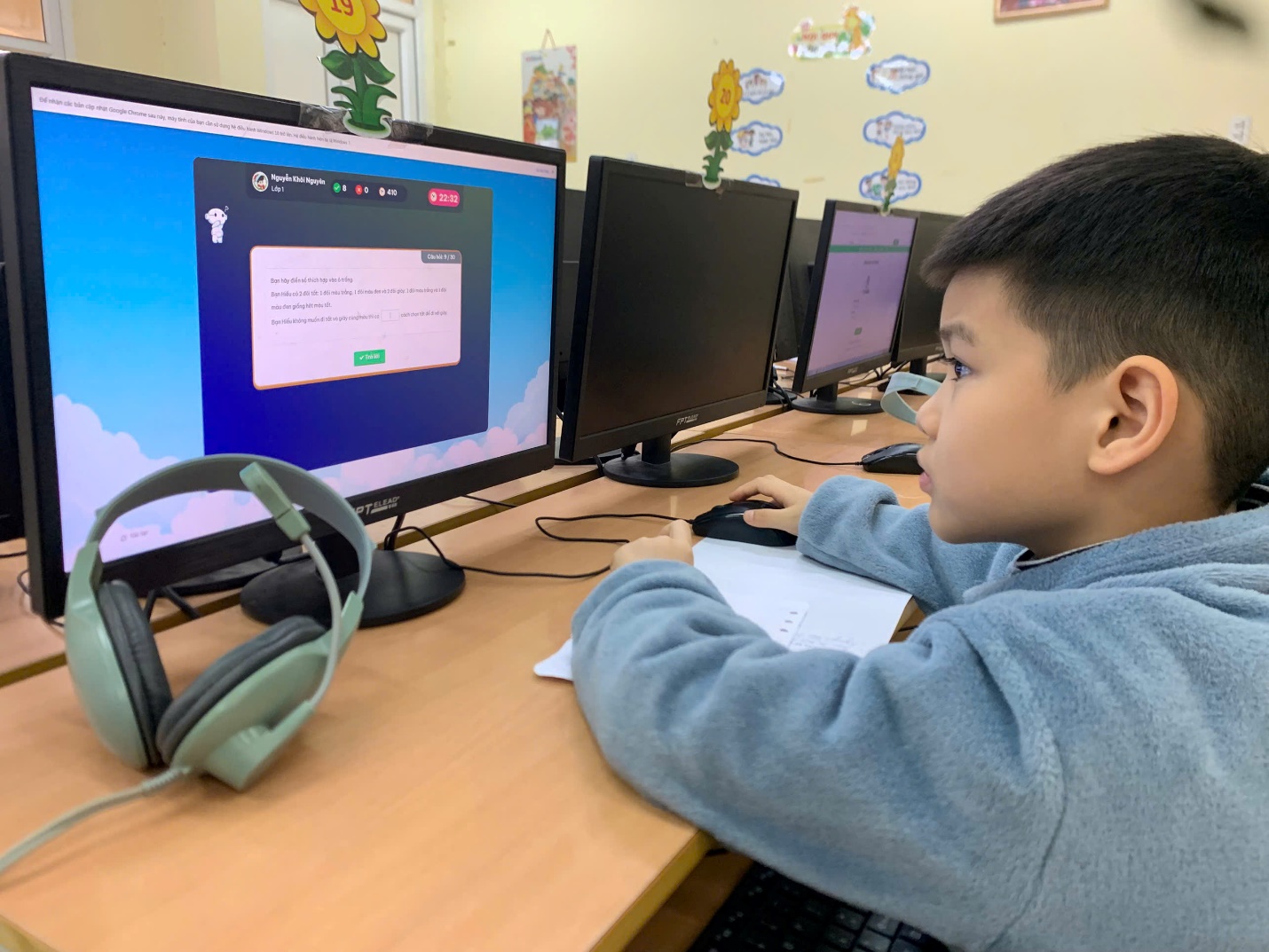A child sitting at a desk with computers

AI-generated content may be incorrect.