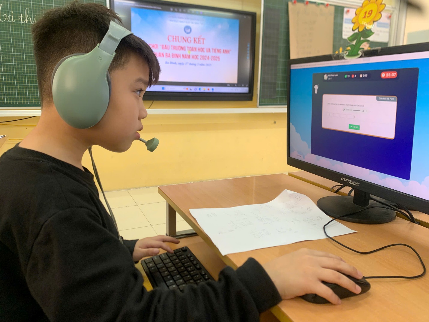 A child wearing headphones and using a computer

AI-generated content may be incorrect.