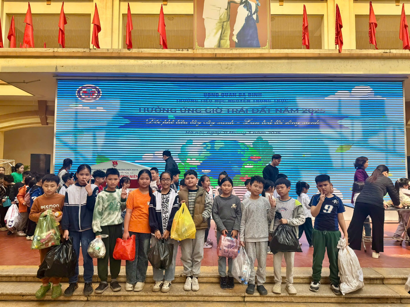 A group of people standing in front of a large sign

AI-generated content may be incorrect.