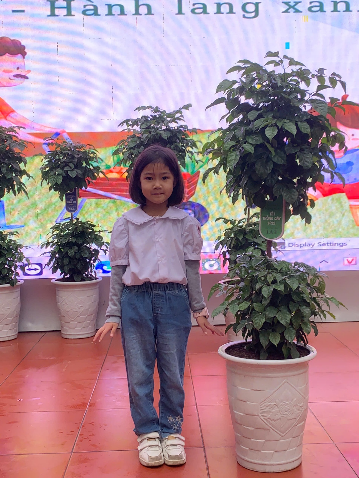 A child standing in front of plants
AI-generated content may be incorrect.