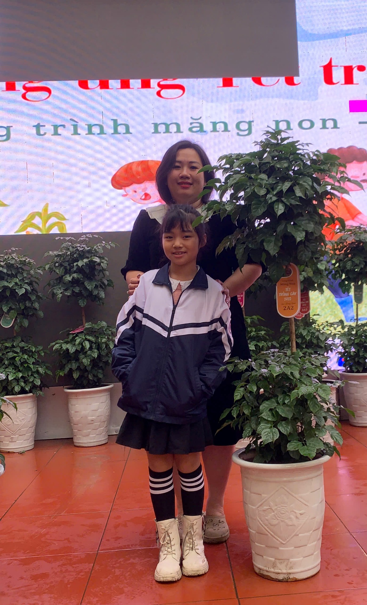 A person and a child posing for a picture
AI-generated content may be incorrect.