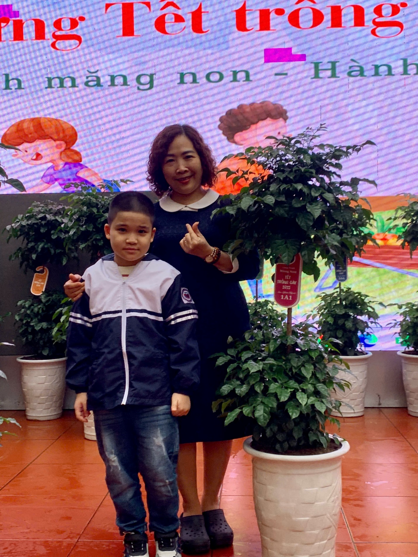 A person and a child posing for a picture
AI-generated content may be incorrect.