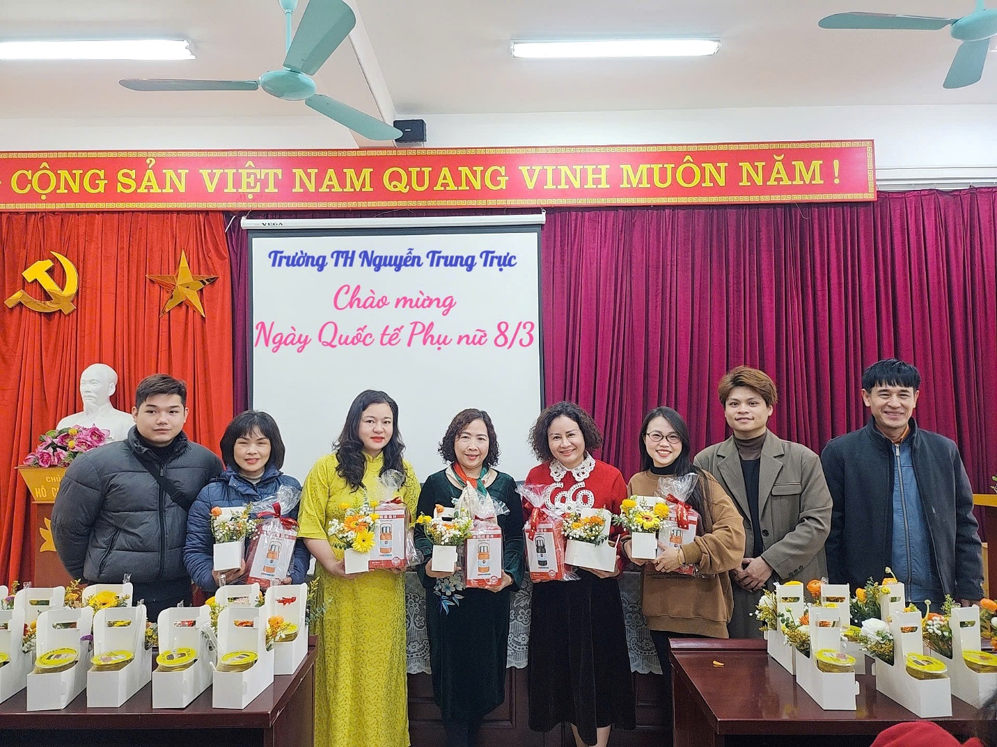 A group of people standing in front of a white board

AI-generated content may be incorrect.