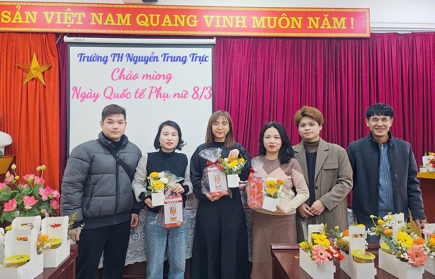 A group of people standing in front of a white board

AI-generated content may be incorrect.