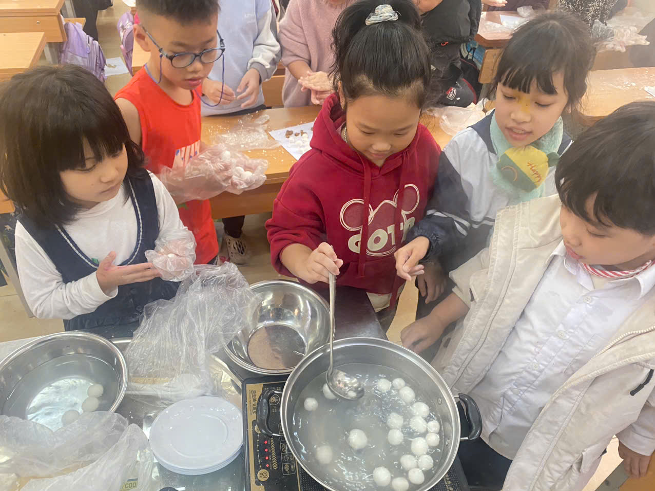 A group of children making food
AI-generated content may be incorrect.