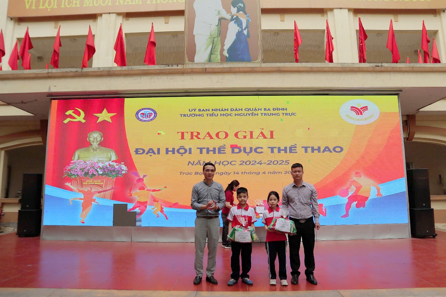 A group of people standing in front of a banner

AI-generated content may be incorrect.