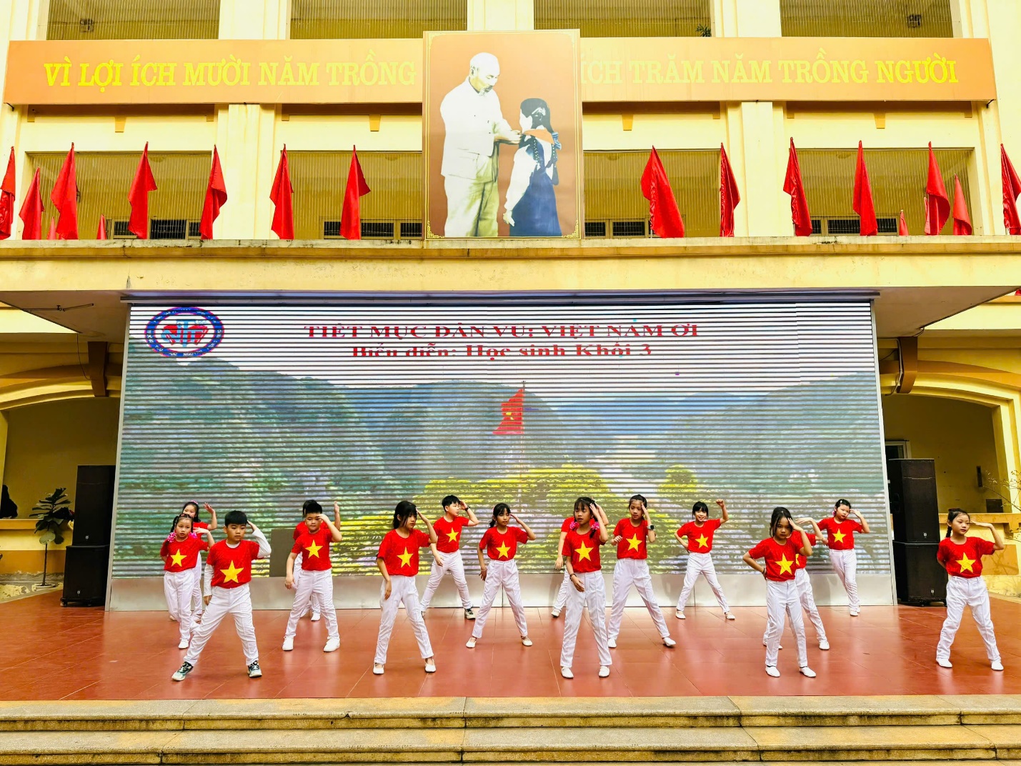 A group of people in red shirts and white pants dancing on a stage

AI-generated content may be incorrect.