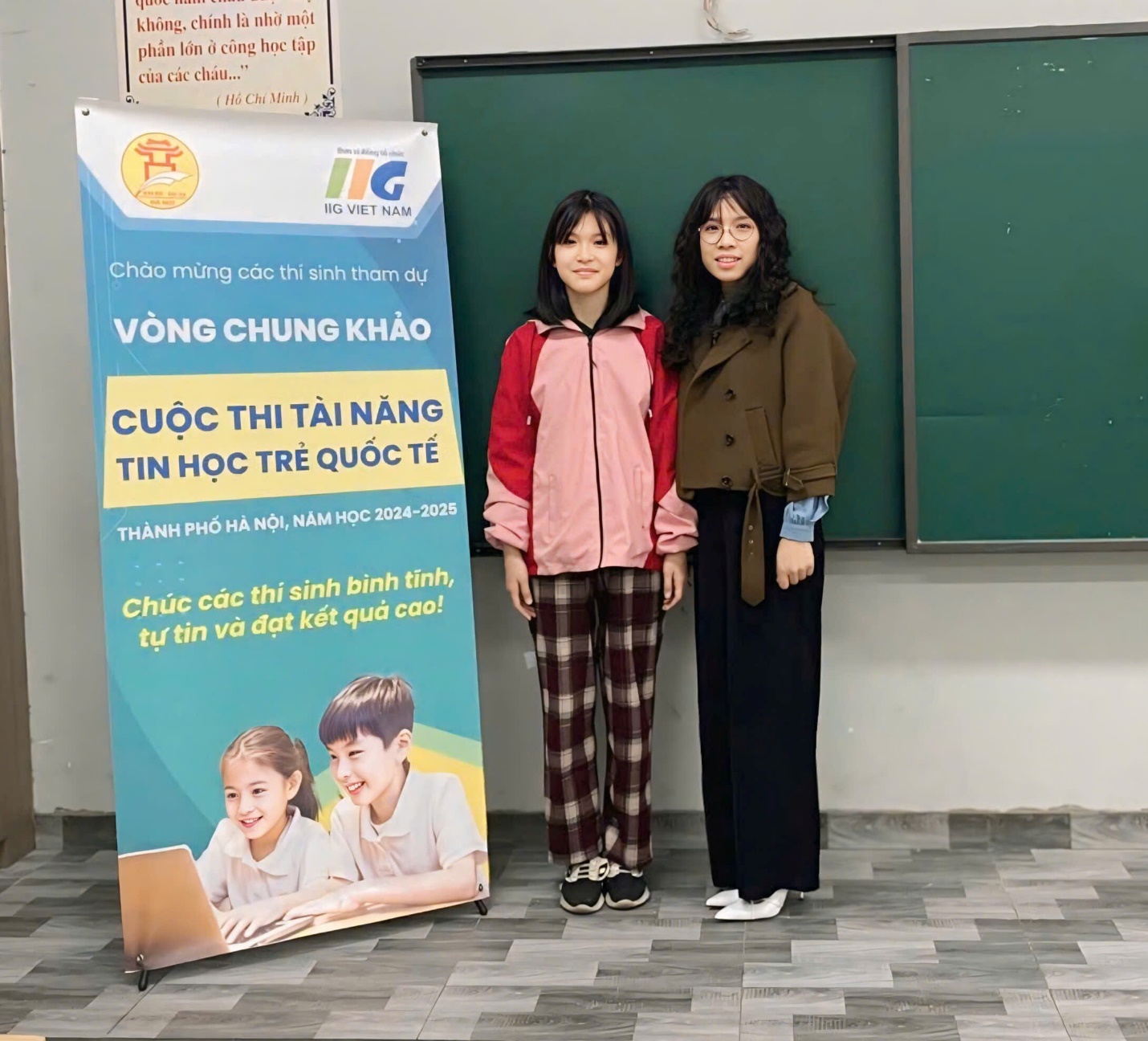 Two women standing next to a sign
AI-generated content may be incorrect.