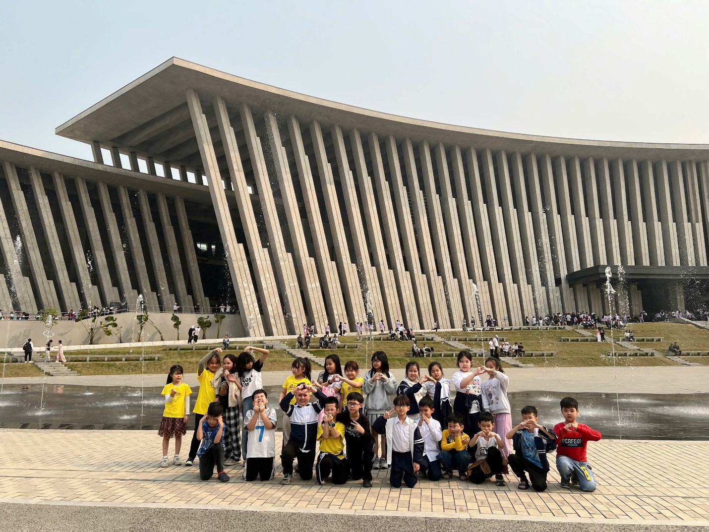 A group of children posing for a picture in front of Parliament House, Helsinki
AI-generated content may be incorrect.