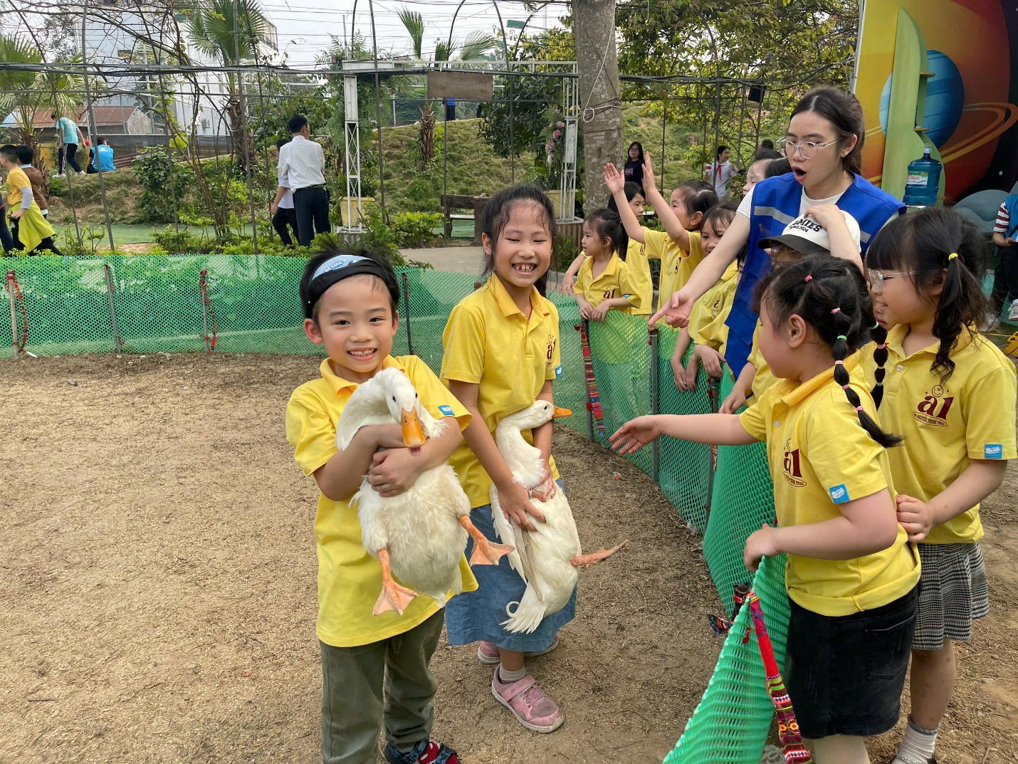 A group of children holding ducks
AI-generated content may be incorrect.