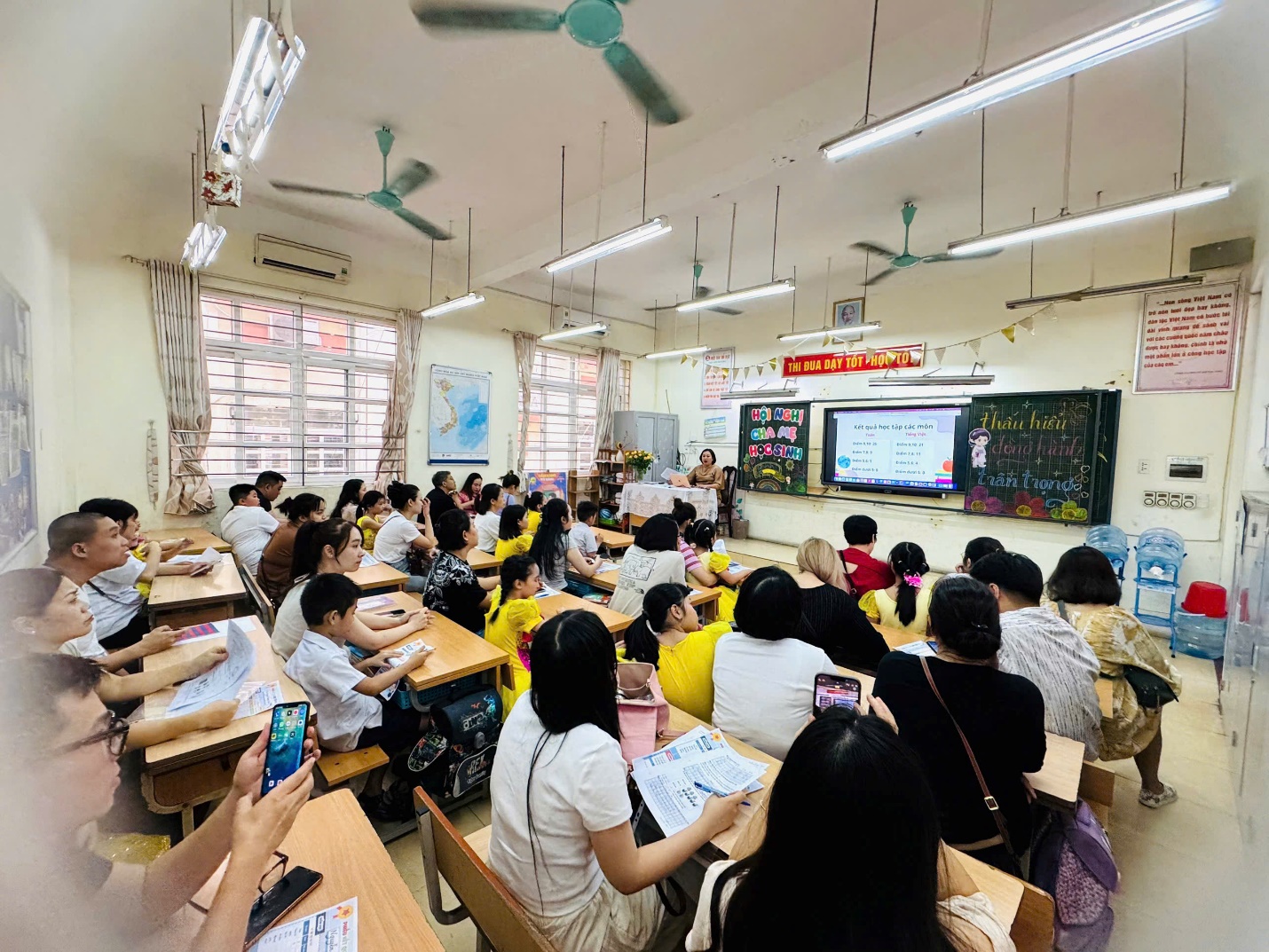 A group of people sitting at desks in a classroom

AI-generated content may be incorrect.