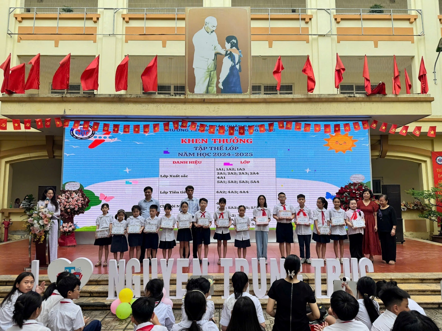 A group of children performing on a stage

AI-generated content may be incorrect.