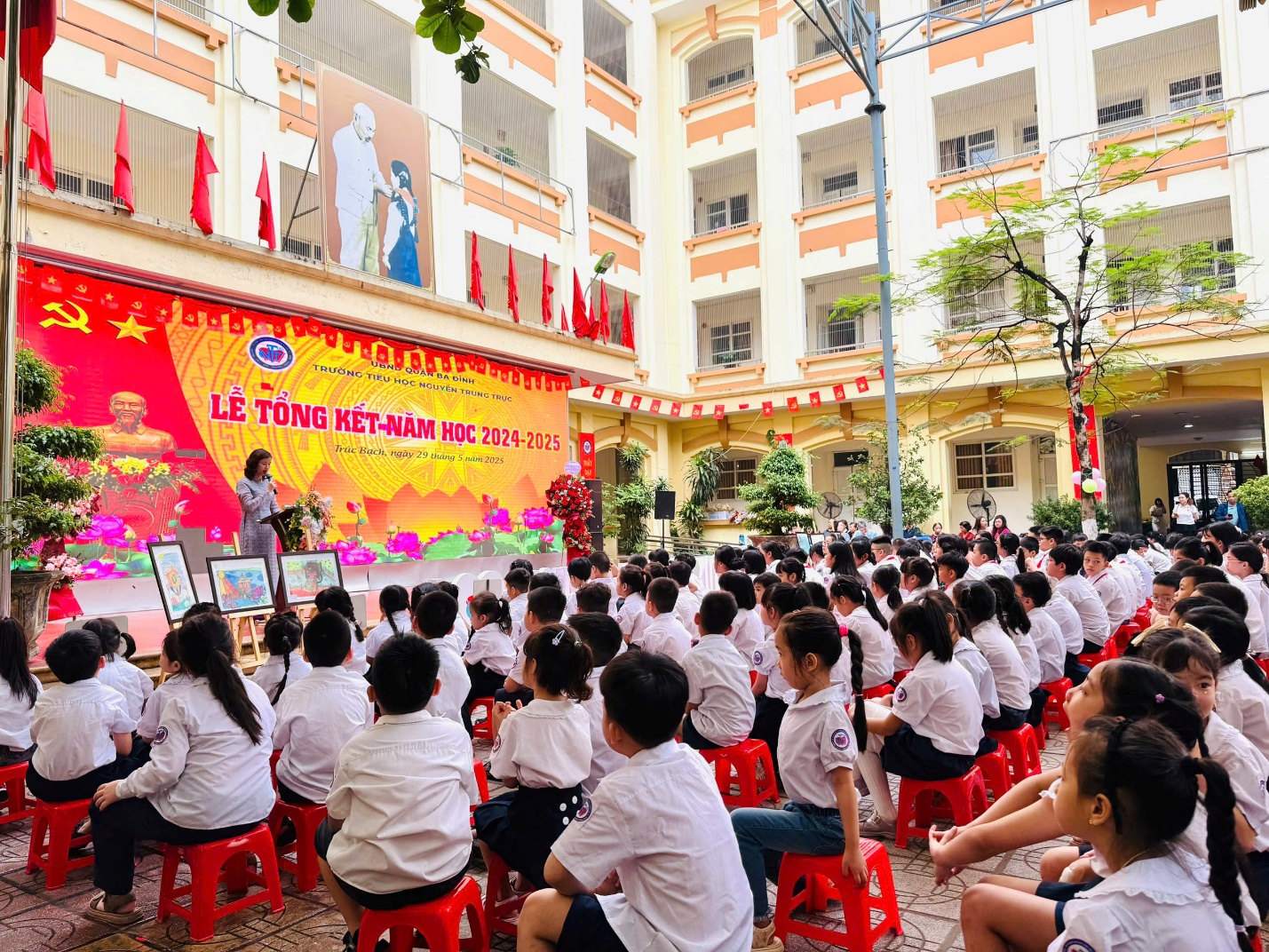 A group of children sitting in chairs in front of a large building

AI-generated content may be incorrect.