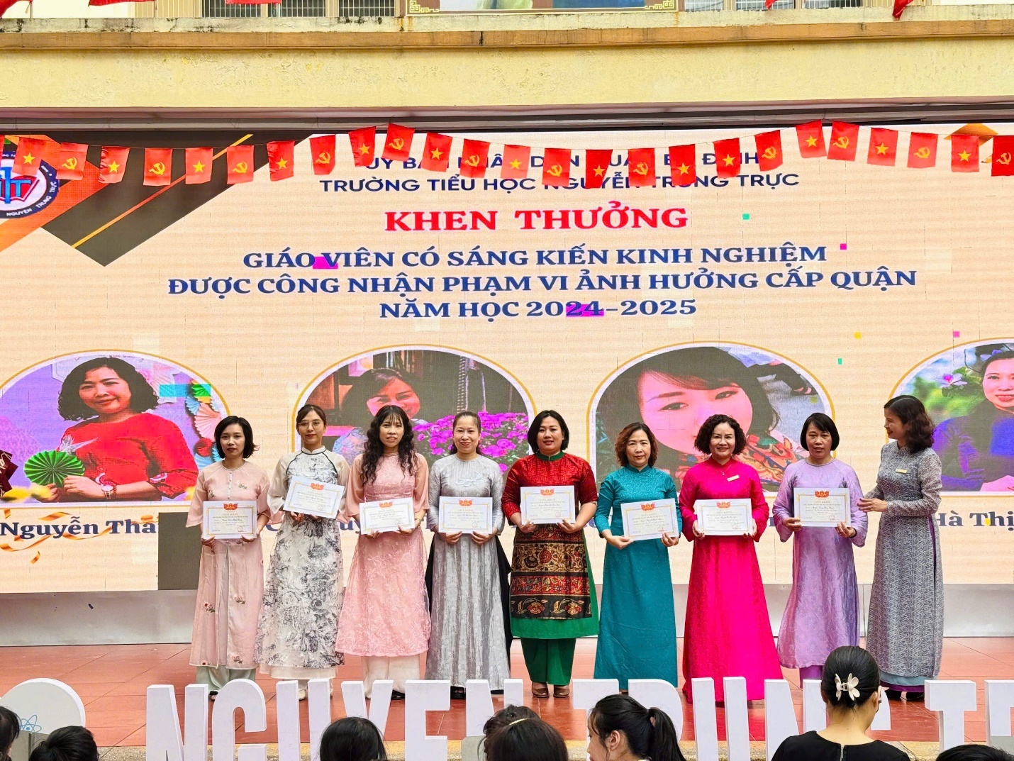 A group of women holding certificates

AI-generated content may be incorrect.