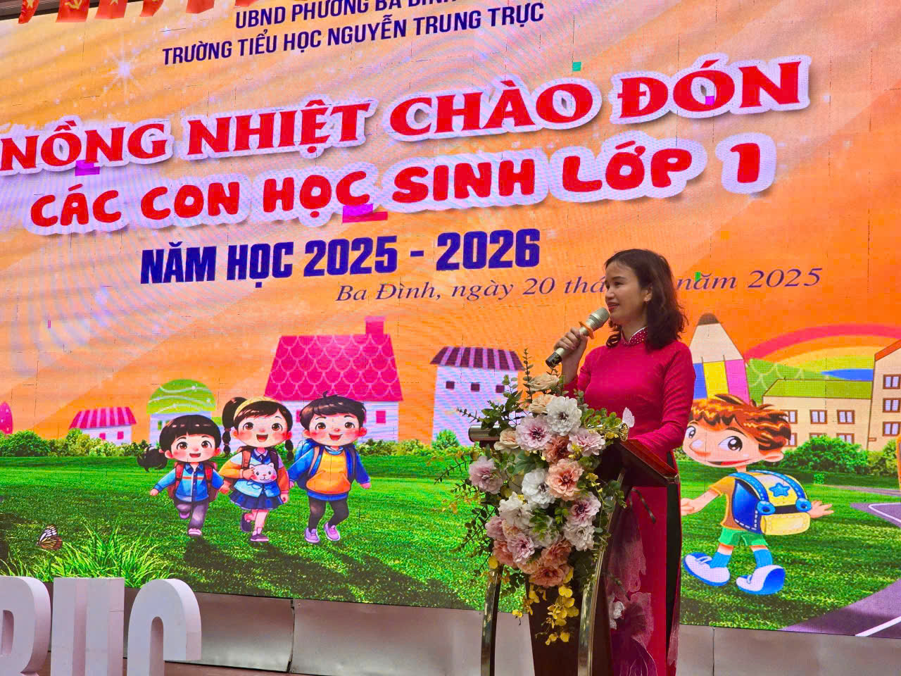 A person standing in front of a large banner

AI-generated content may be incorrect.