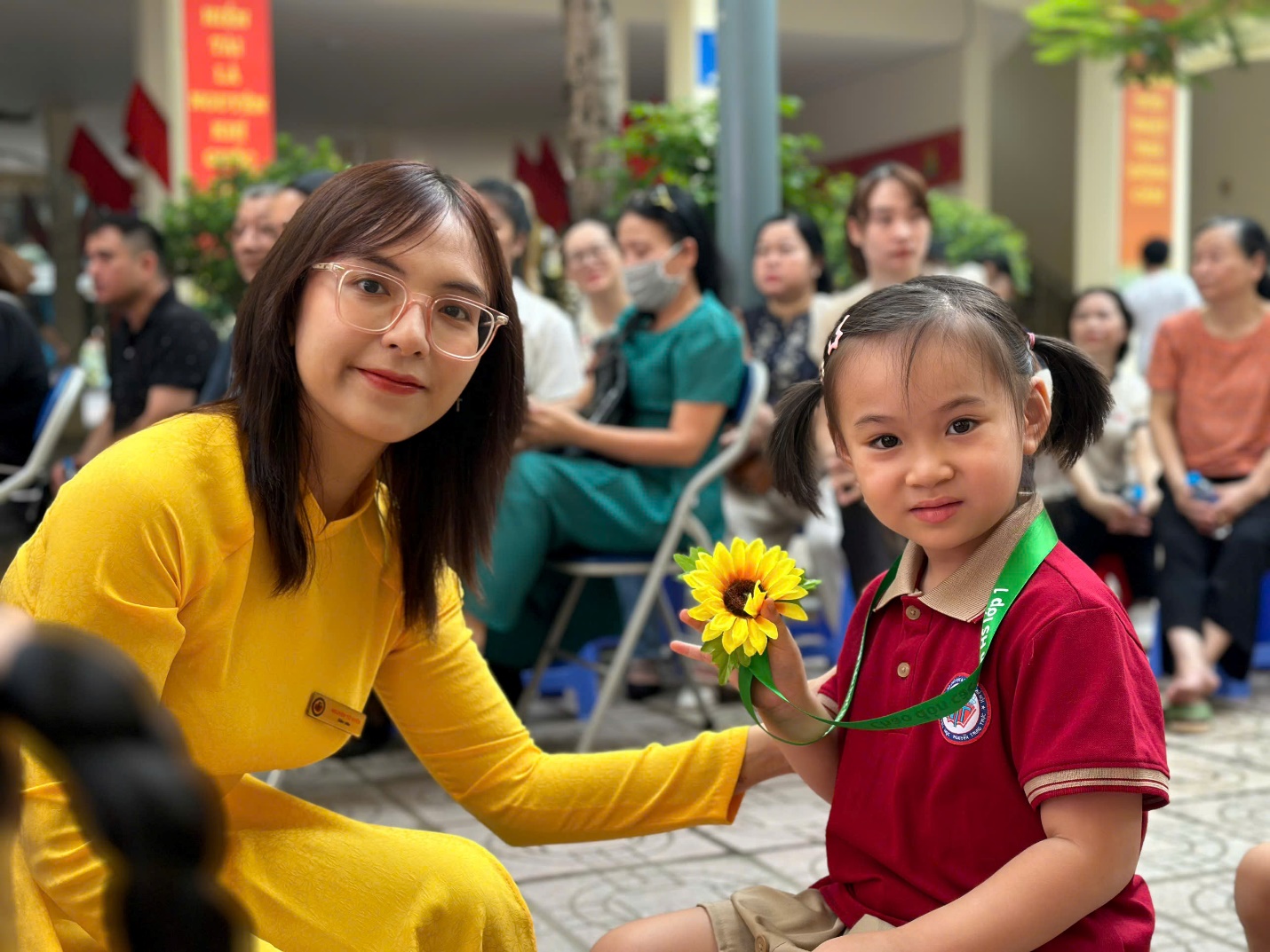 A person and a child sitting on the ground

AI-generated content may be incorrect.