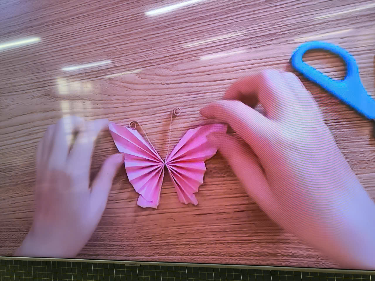 A person making a butterfly
AI-generated content may be incorrect.