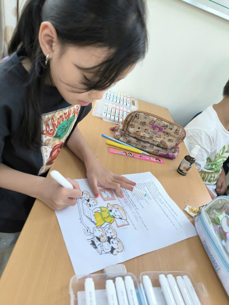 A child drawing on a piece of paper
AI-generated content may be incorrect.