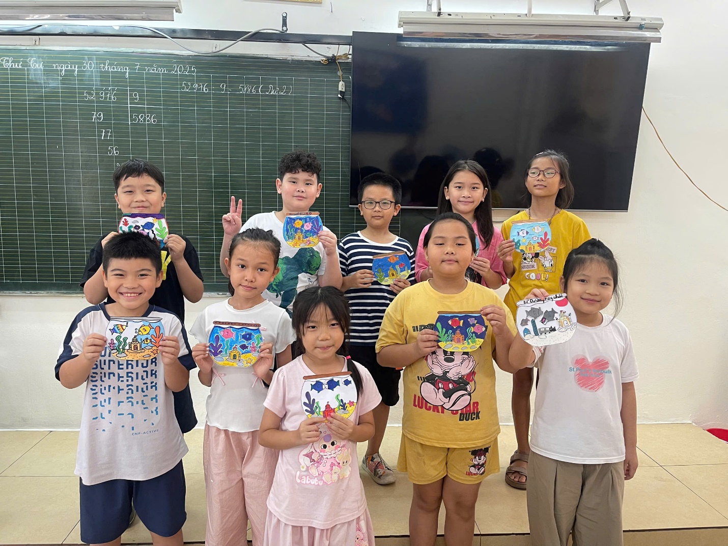 A group of children holding up paper
AI-generated content may be incorrect.