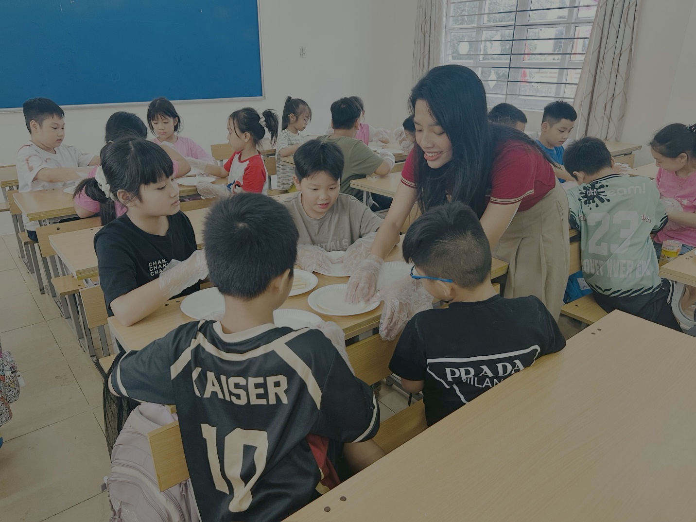 A group of children sitting at desks in a classroom

AI-generated content may be incorrect.