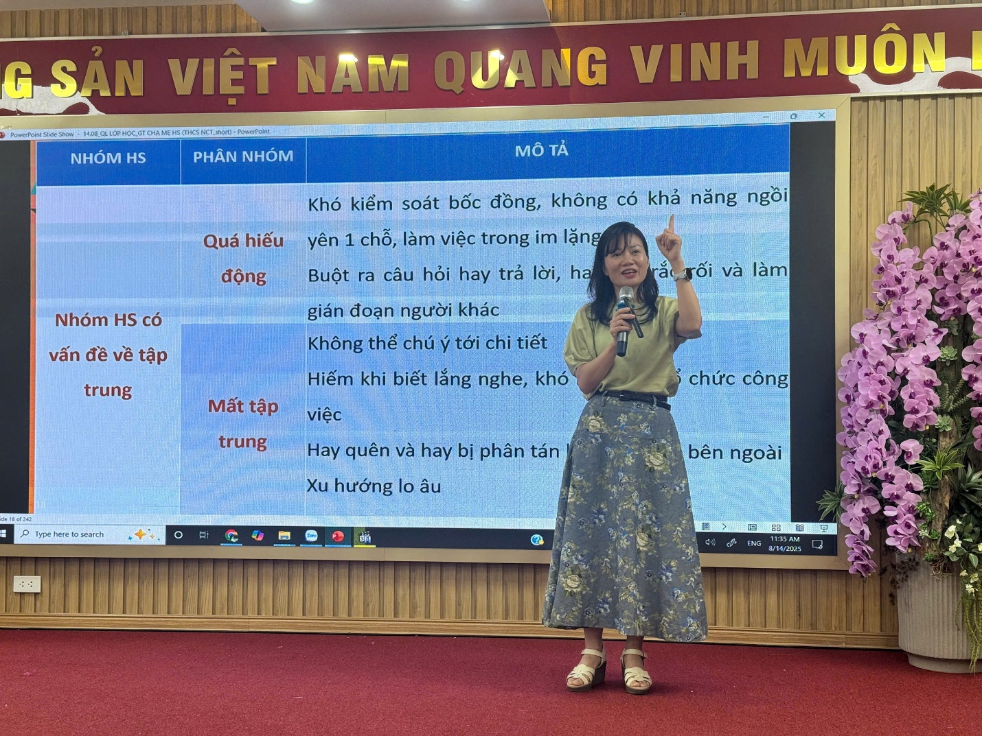 A person standing in front of a large screen

AI-generated content may be incorrect.