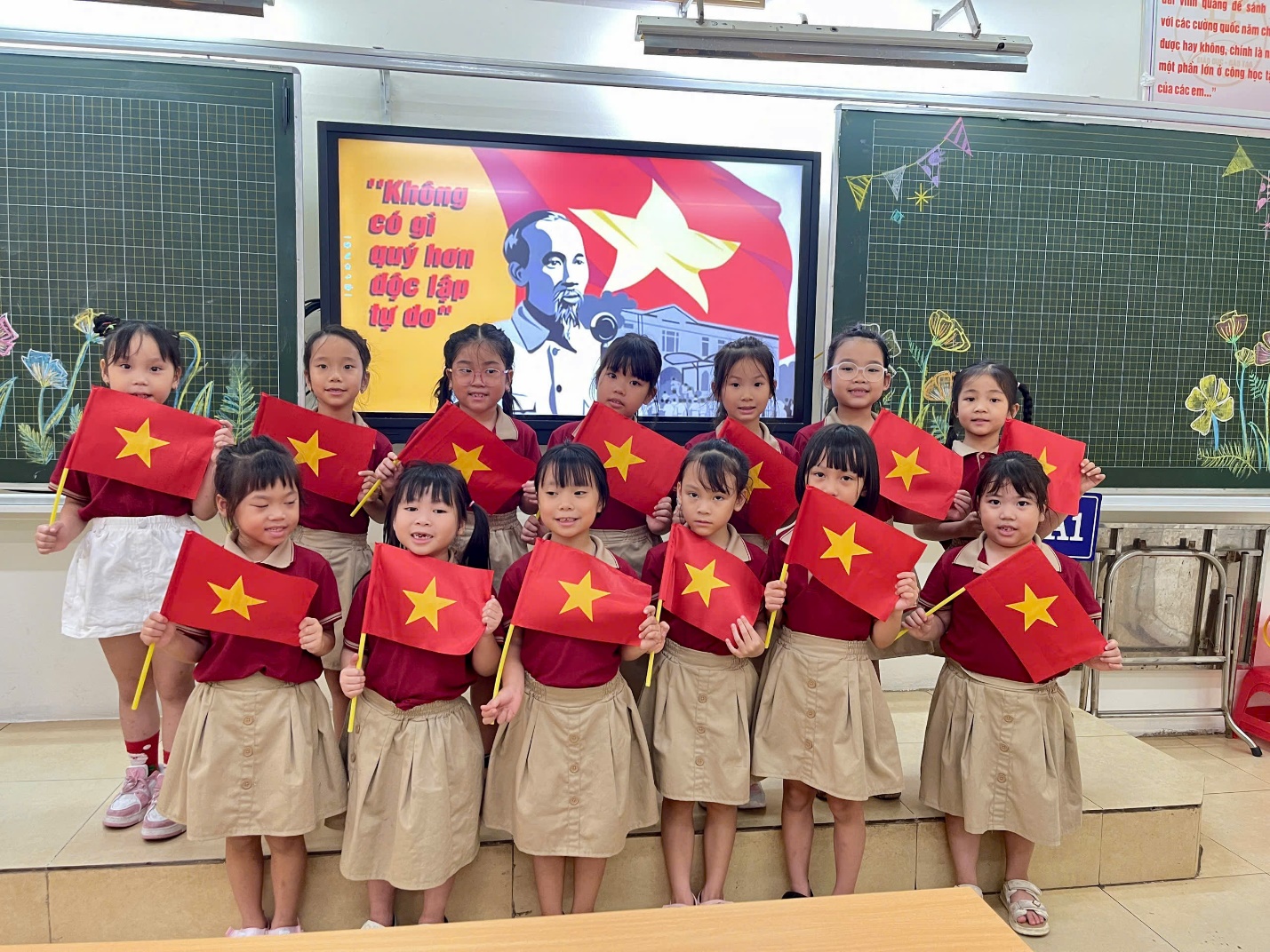 A group of children holding flags

AI-generated content may be incorrect.