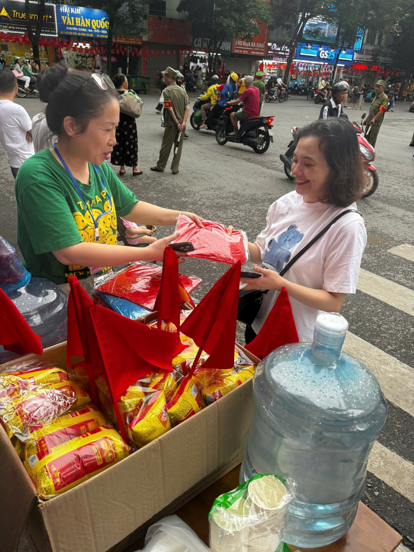 A person handing a package to a person
AI-generated content may be incorrect.