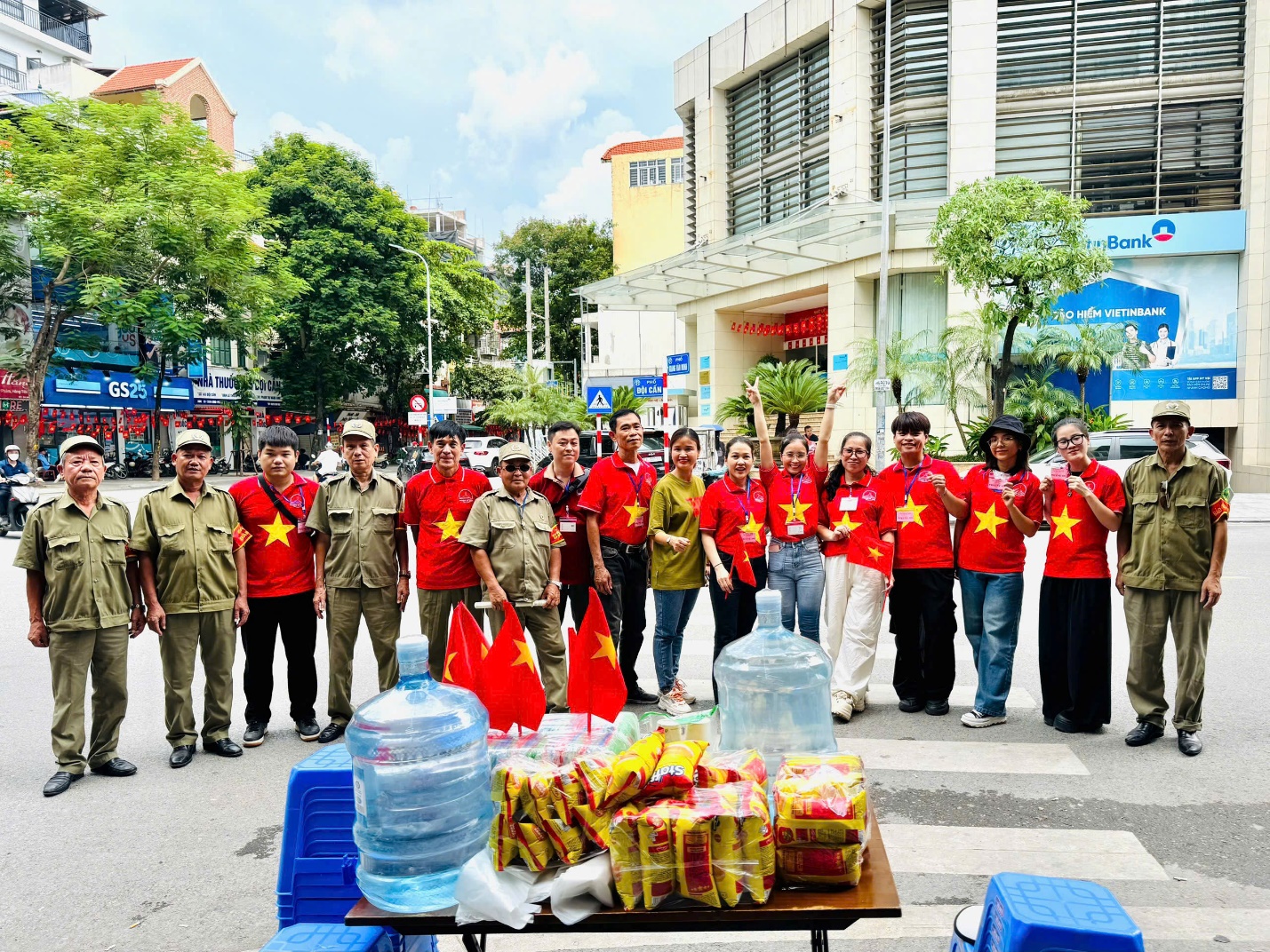 A group of people standing in front of a table with food
AI-generated content may be incorrect.