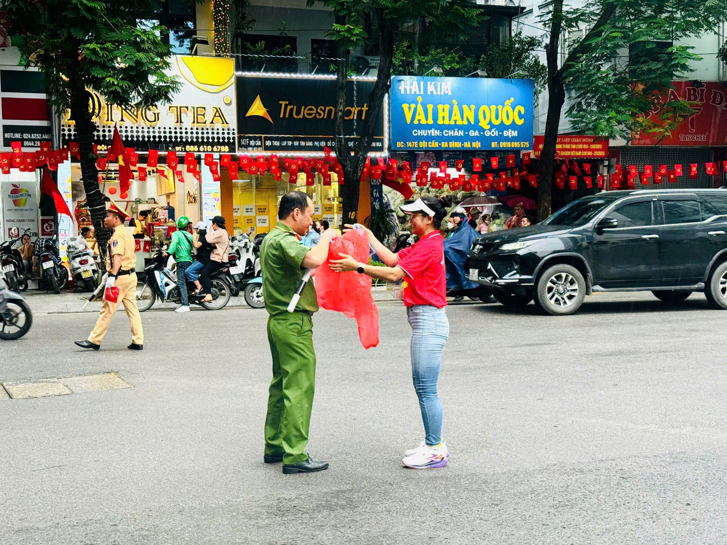 A person handing a red flag to a person
AI-generated content may be incorrect.