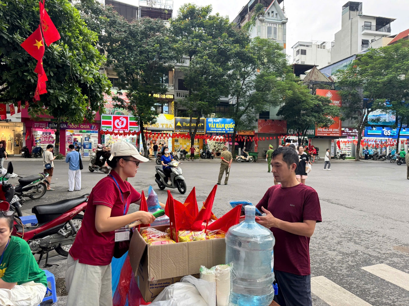 A person standing next to a box of water
AI-generated content may be incorrect.