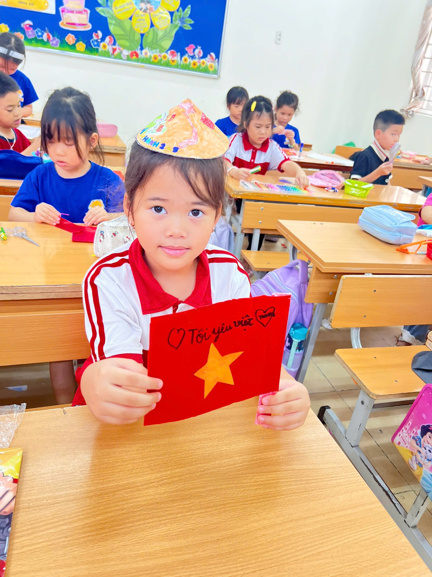 A child in a classroom holding a red sign

AI-generated content may be incorrect.