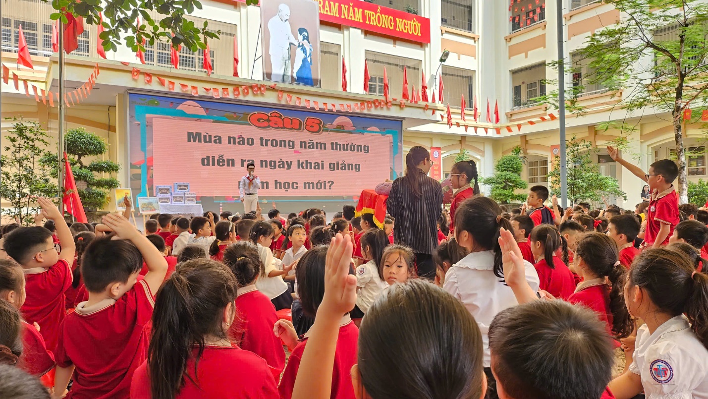 A group of people in red shirts raising their hands

AI-generated content may be incorrect.