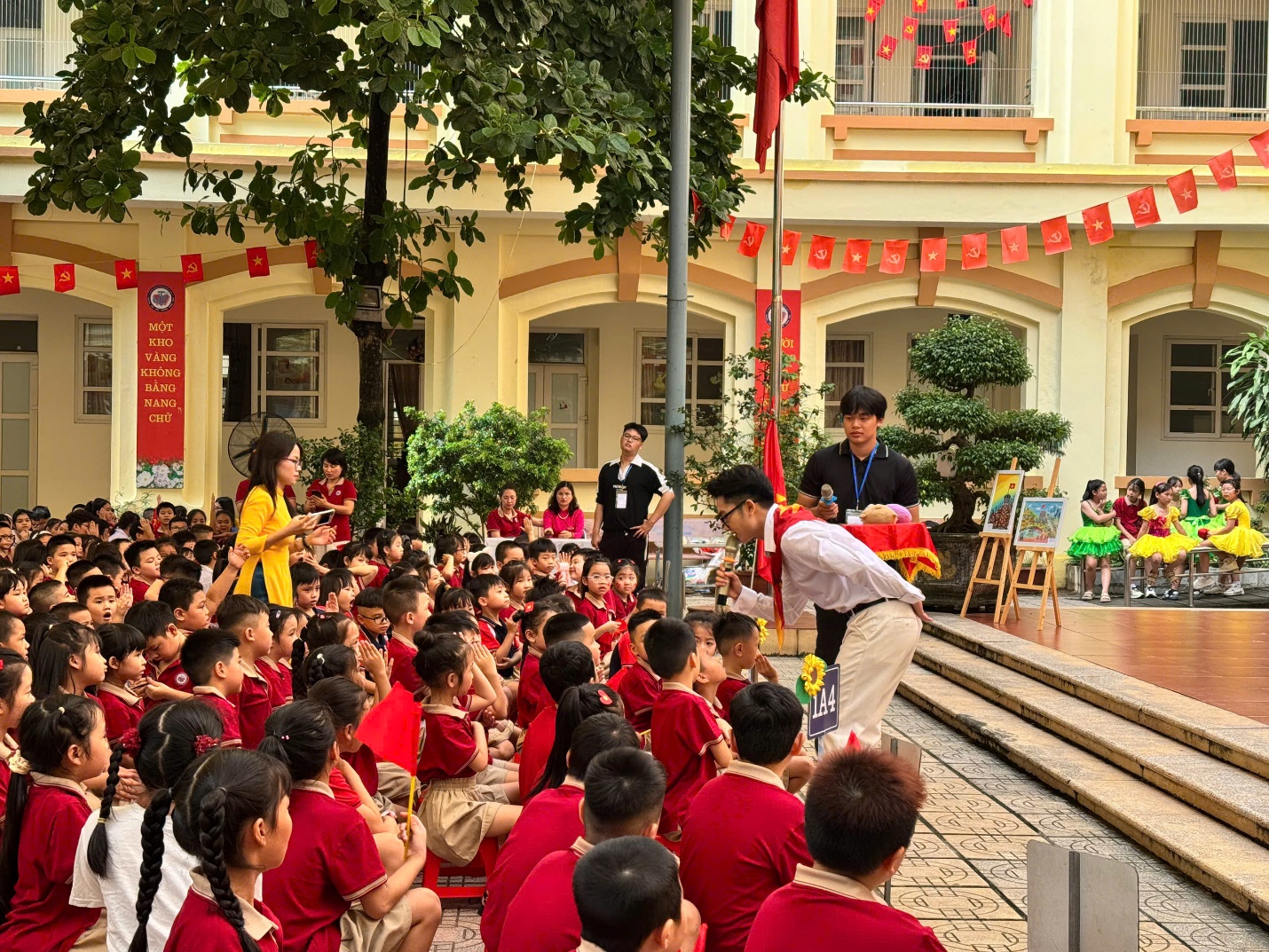 A group of children sitting on steps in front of a building

AI-generated content may be incorrect.