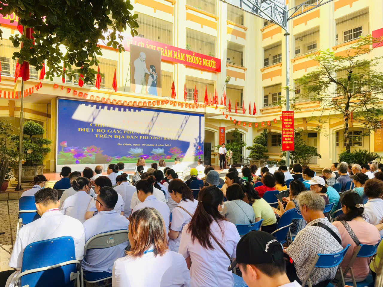A group of people sitting in chairs outside a building

AI-generated content may be incorrect.