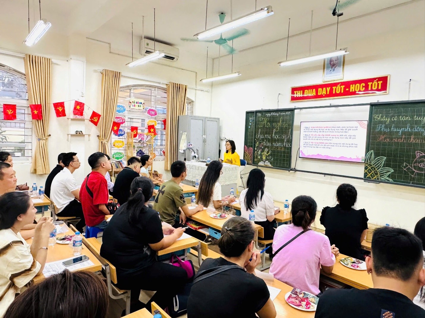 A group of people sitting at desks in a classroom

AI-generated content may be incorrect.