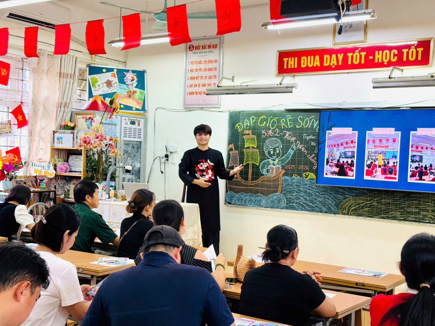 A person standing in front of a classroom with a group of people

AI-generated content may be incorrect.