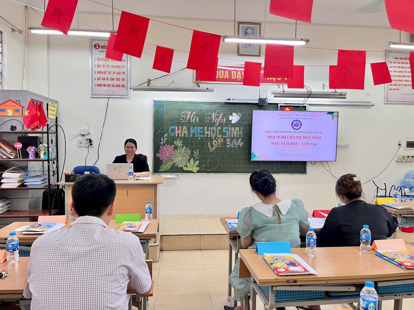 A group of people sitting at desks in a classroom

AI-generated content may be incorrect.