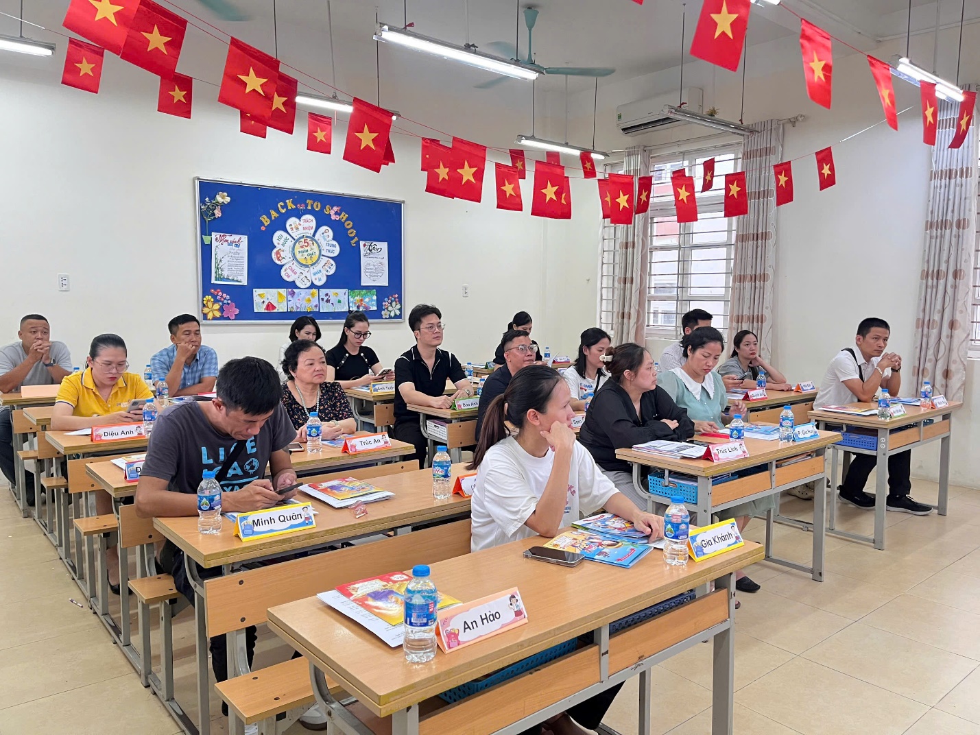 A group of people sitting at desks in a classroom

AI-generated content may be incorrect.