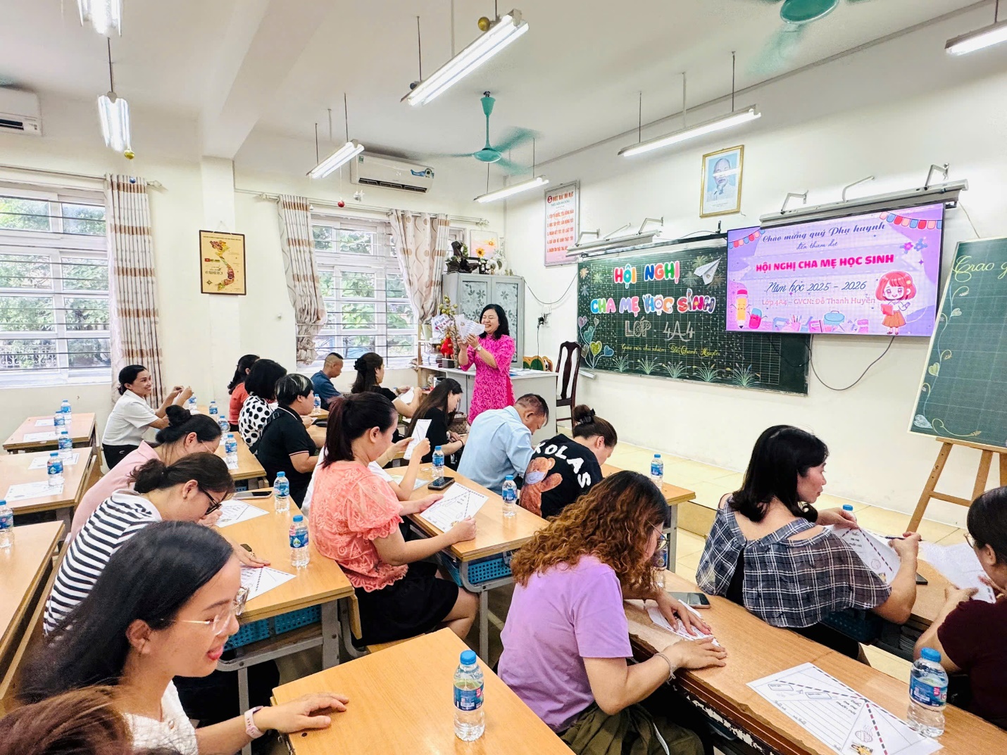 A group of people sitting at desks in a classroom

AI-generated content may be incorrect.