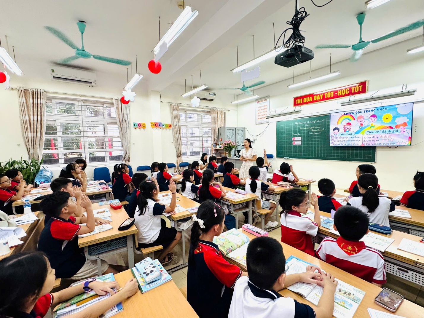 A group of children sitting at desks in a classroom

AI-generated content may be incorrect.