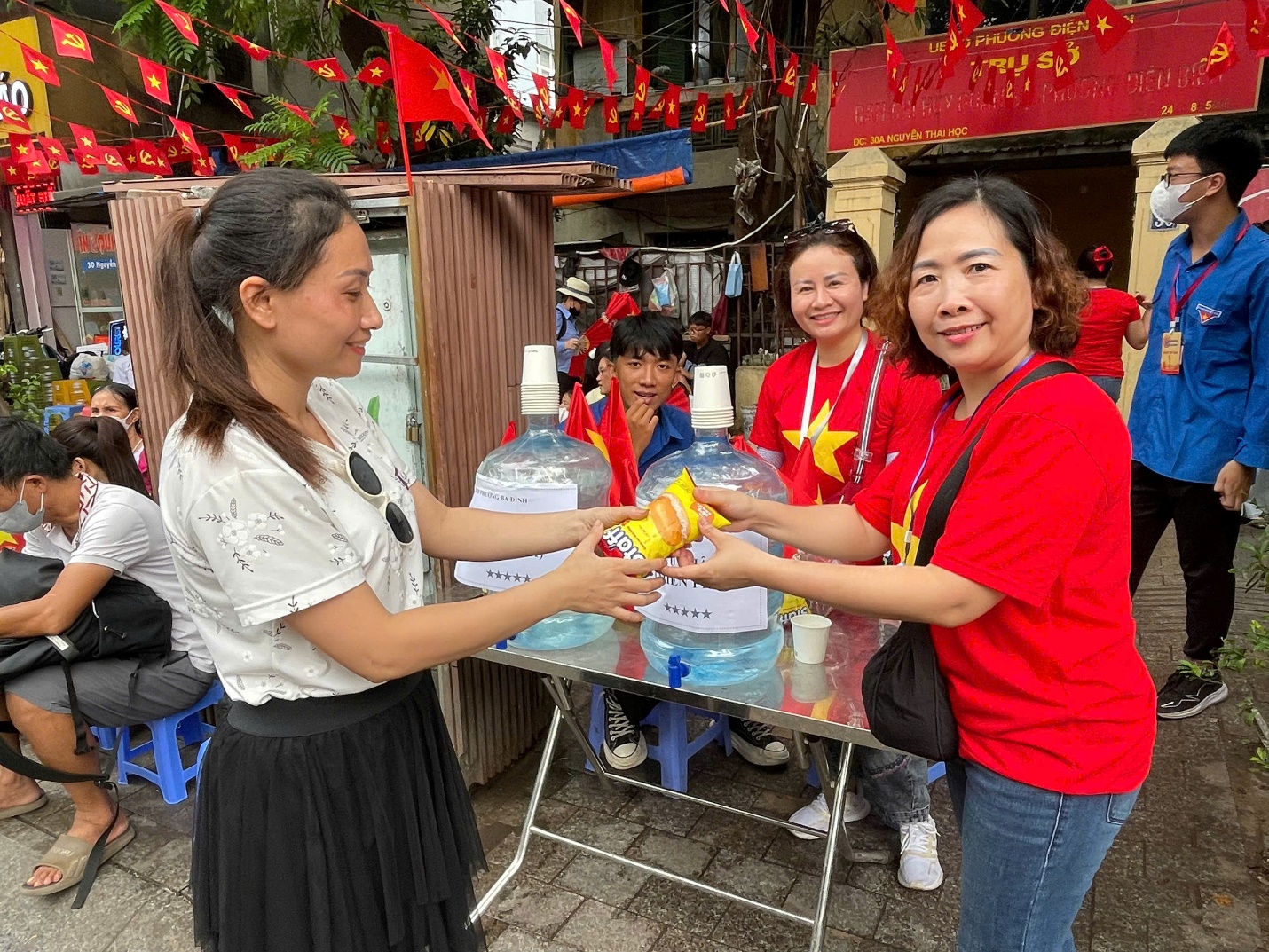 A group of people standing next to each other

AI-generated content may be incorrect.