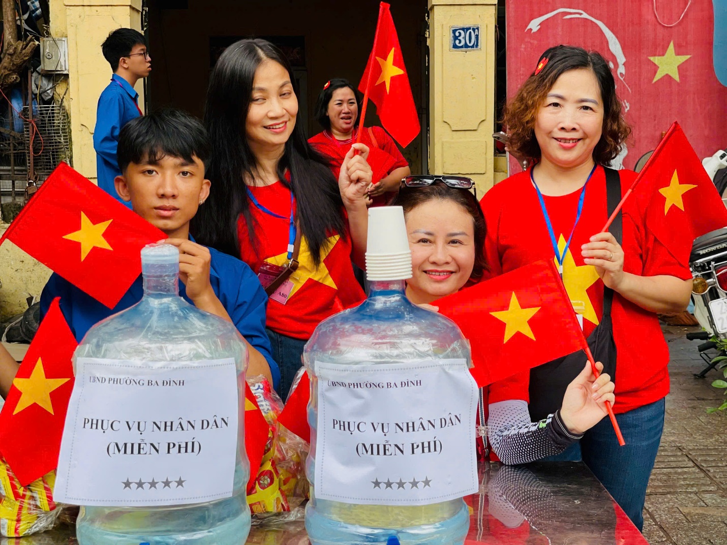 A group of people holding flags

AI-generated content may be incorrect.