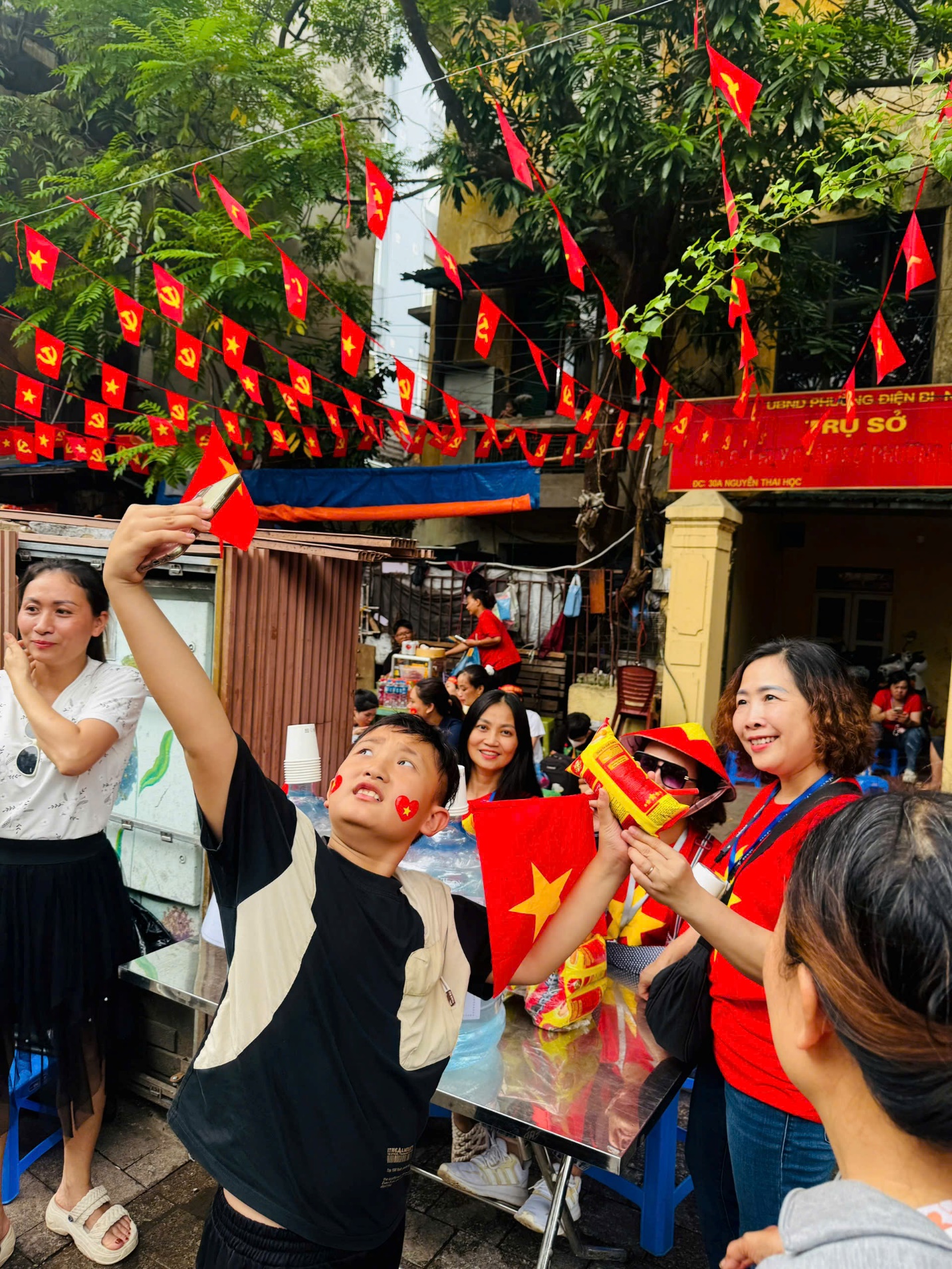 A group of people outside with flags

AI-generated content may be incorrect.