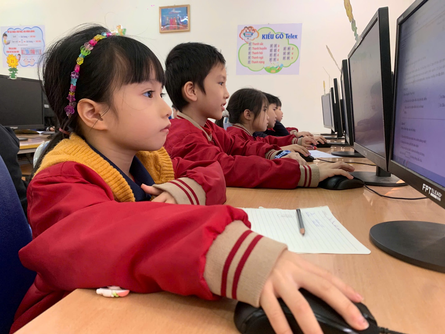A group of children using computers

AI-generated content may be incorrect.
