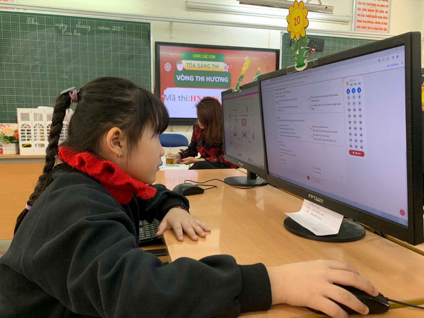 A child sitting at a desk with a computer

AI-generated content may be incorrect.