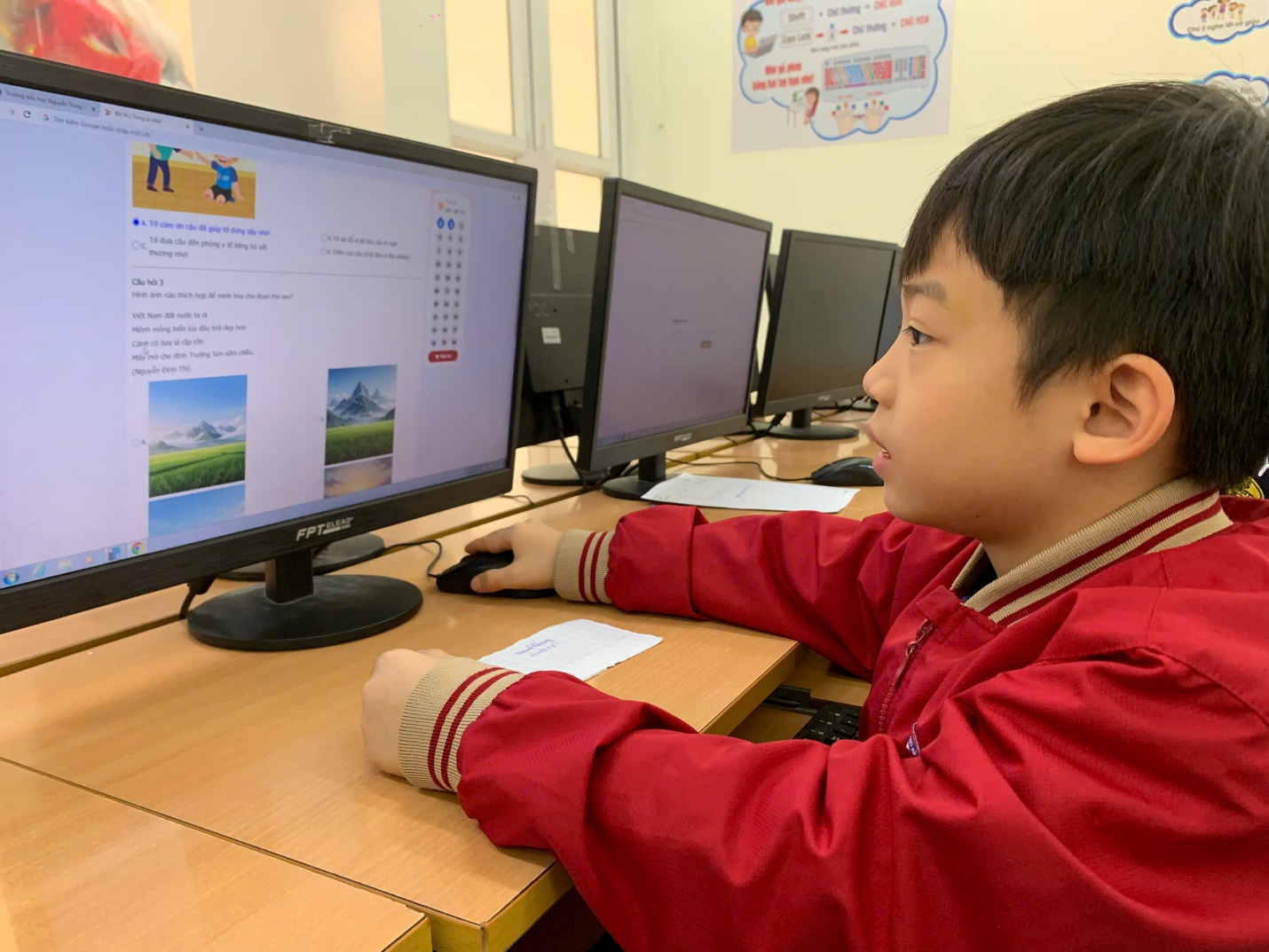 A child sitting at a desk with a computer

AI-generated content may be incorrect.