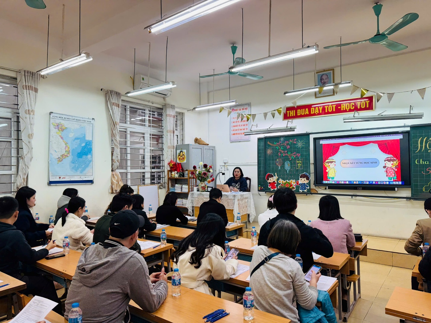 A group of people sitting at desks in a classroom

AI-generated content may be incorrect.