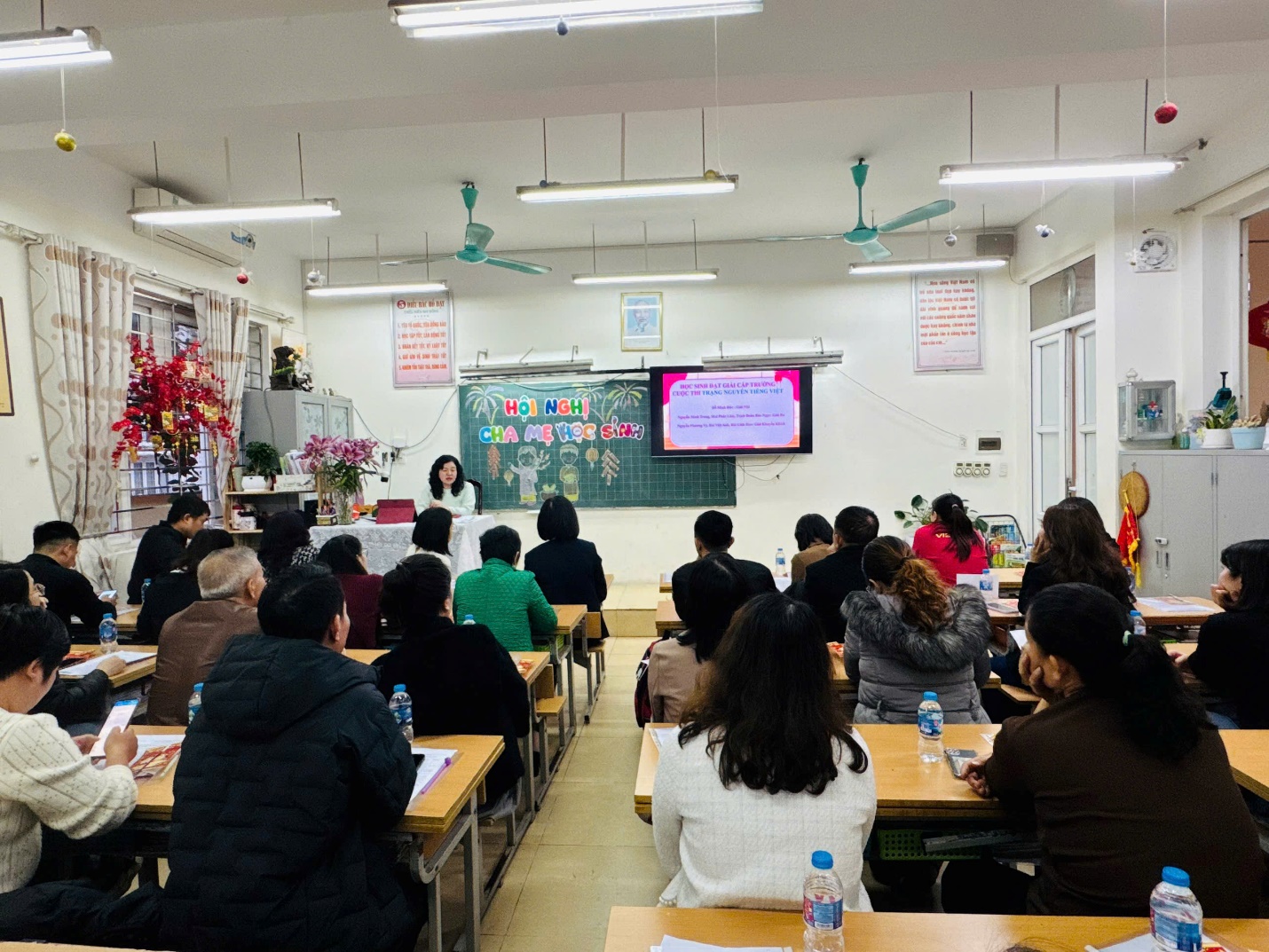 A group of people sitting at desks in a classroom

AI-generated content may be incorrect.